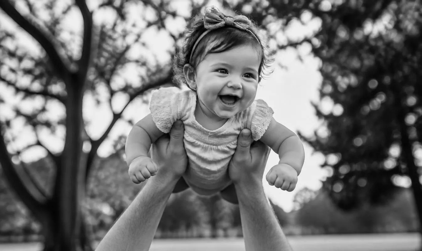 Baby lifted into the air during an outdoor family session