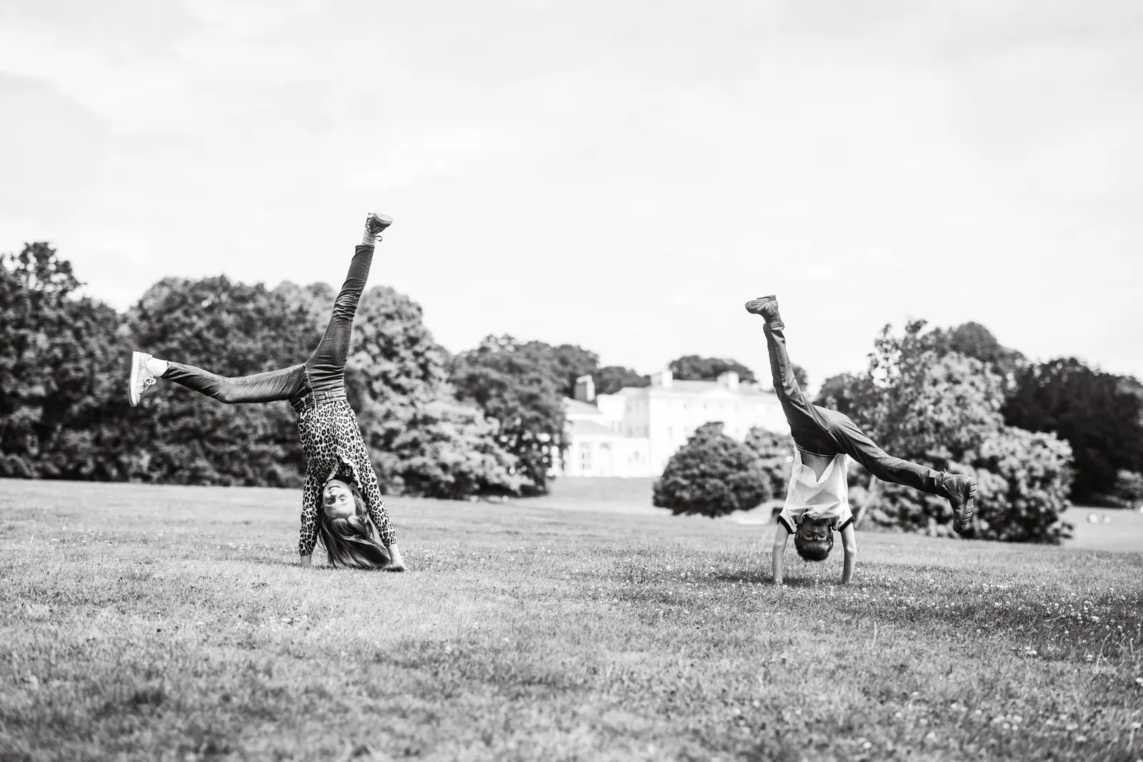 Kids doing cartwheels in a park