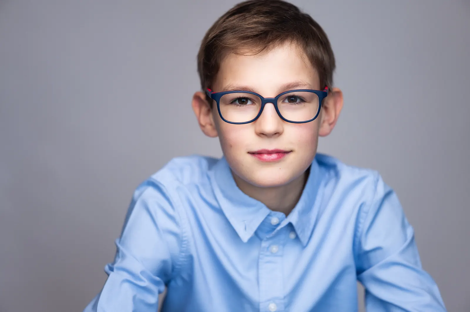 Young boy in blue shirt portrait