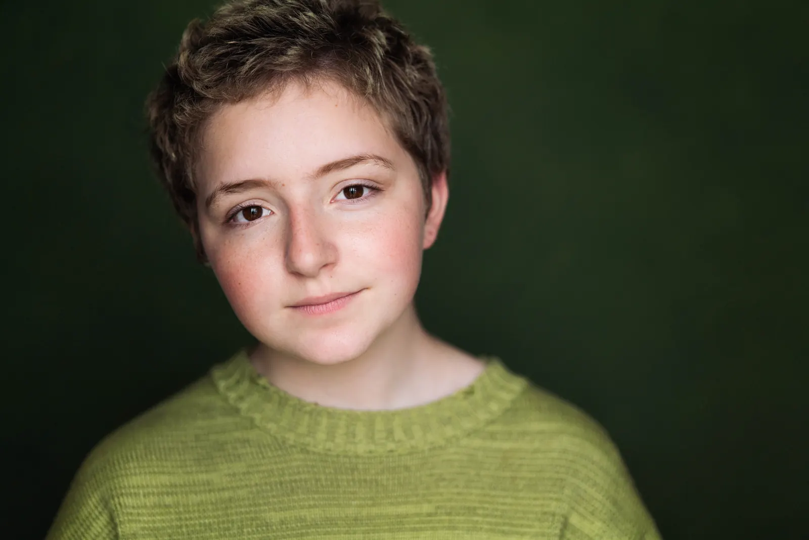 Teen portrait in green sweater