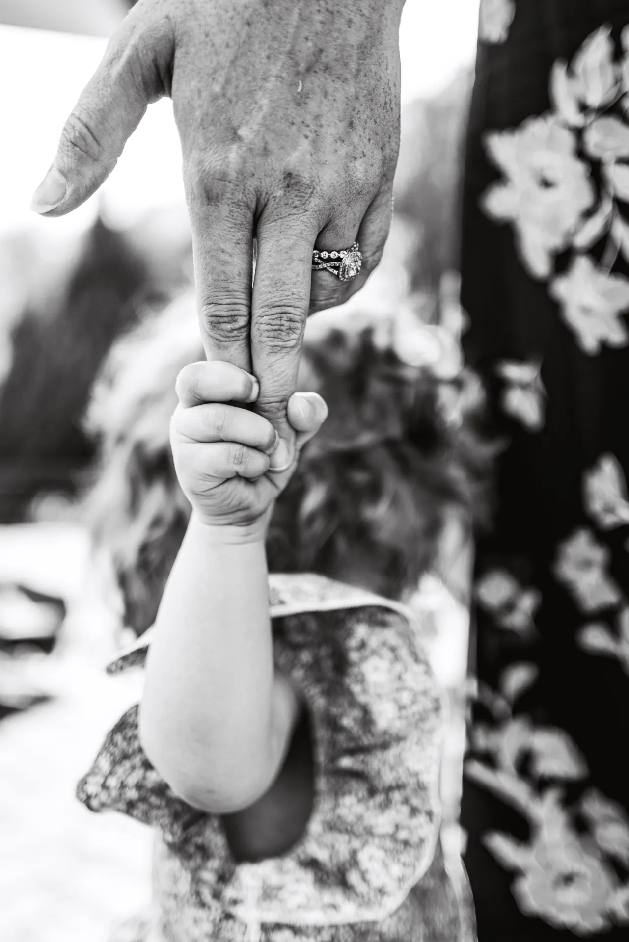 Parent holding child's hand
